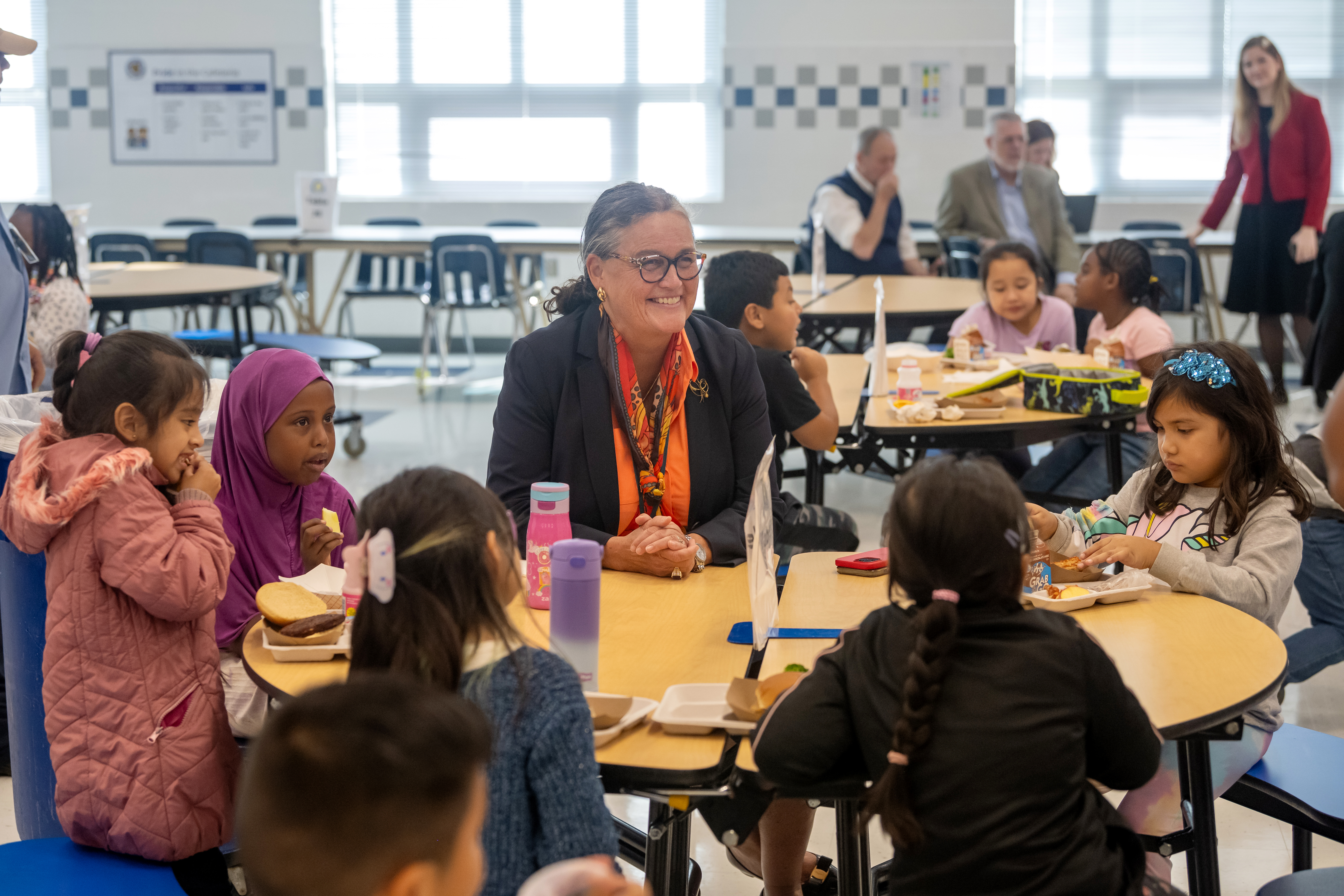 Superintendent Dr. Michelle Reid joins an Annandale Terrace ES student at the cafeteria table.