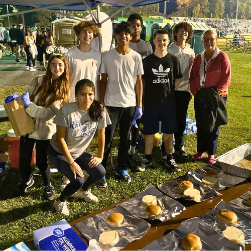 Dr. Reid with students at the LBSS Burger Pit