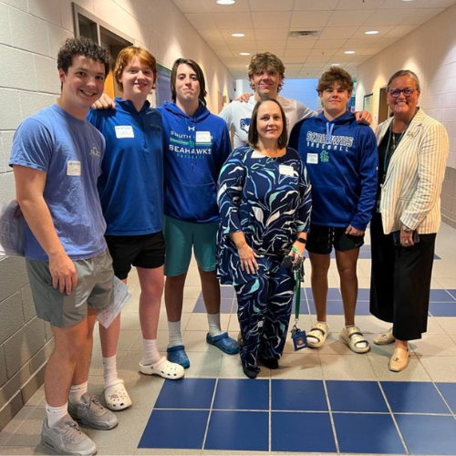 Dr Reid at South Lakes HS with Principal Kimberly Retzer and student ambassadors