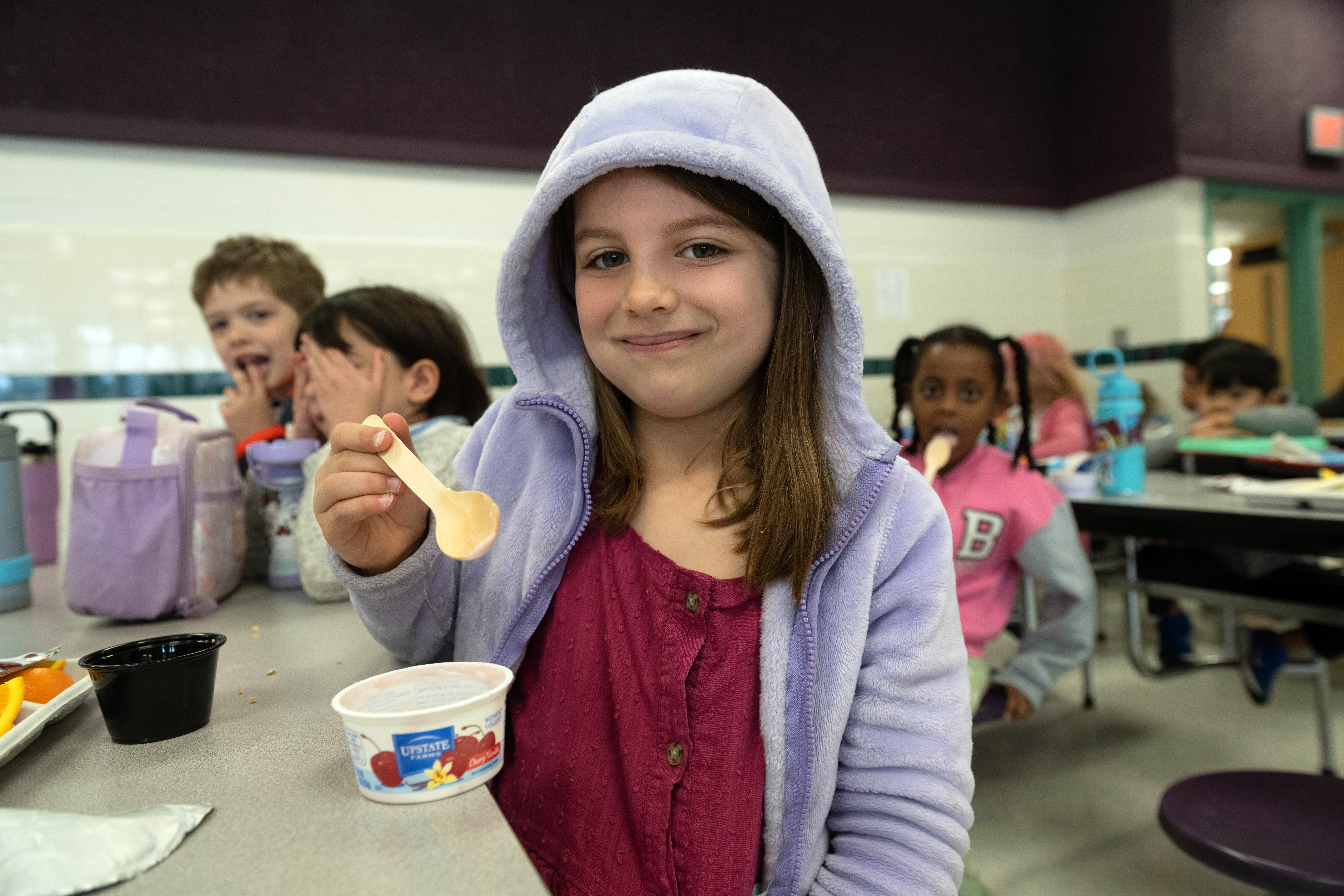 A student at Hunters Woods ES shows off her new wooden utensil