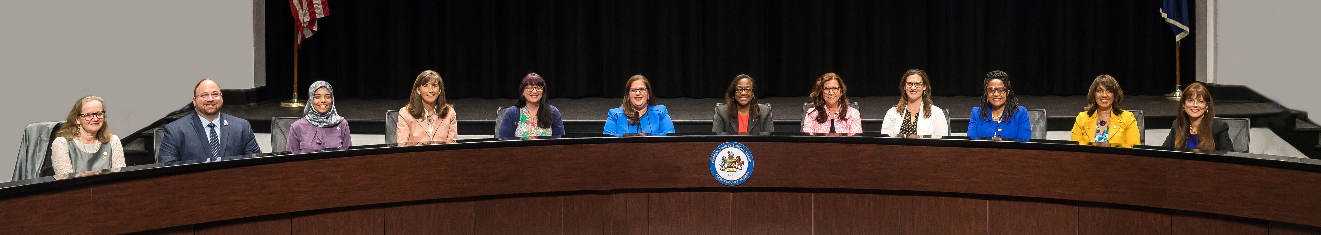 School board members on the dais at Jackson Middle School