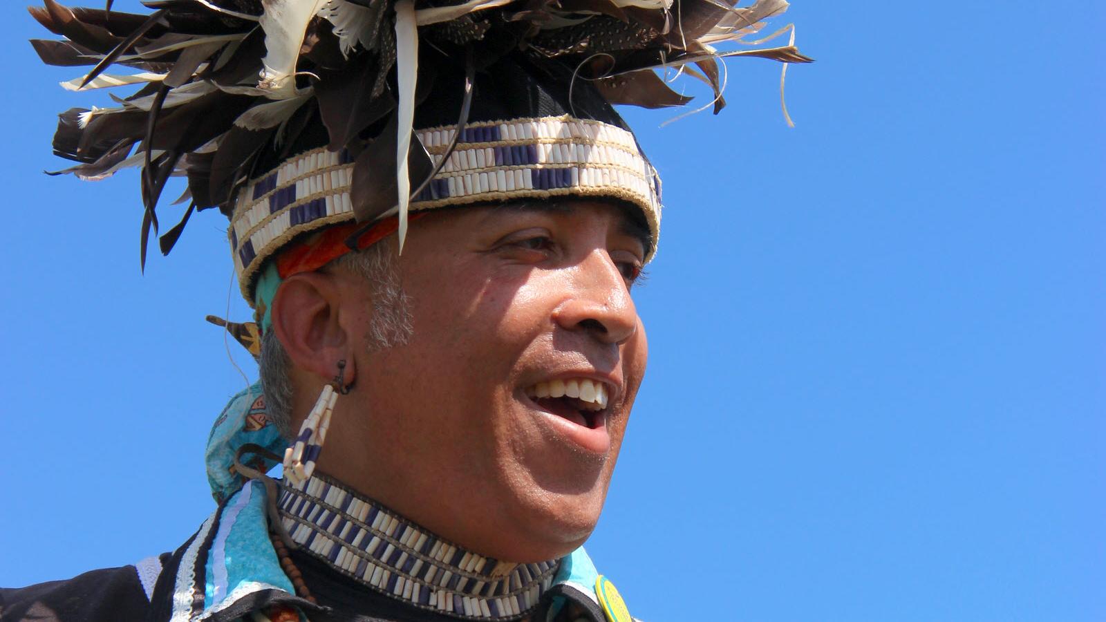 Senior technology specialist in headdress celebrates Native American Heritage Month