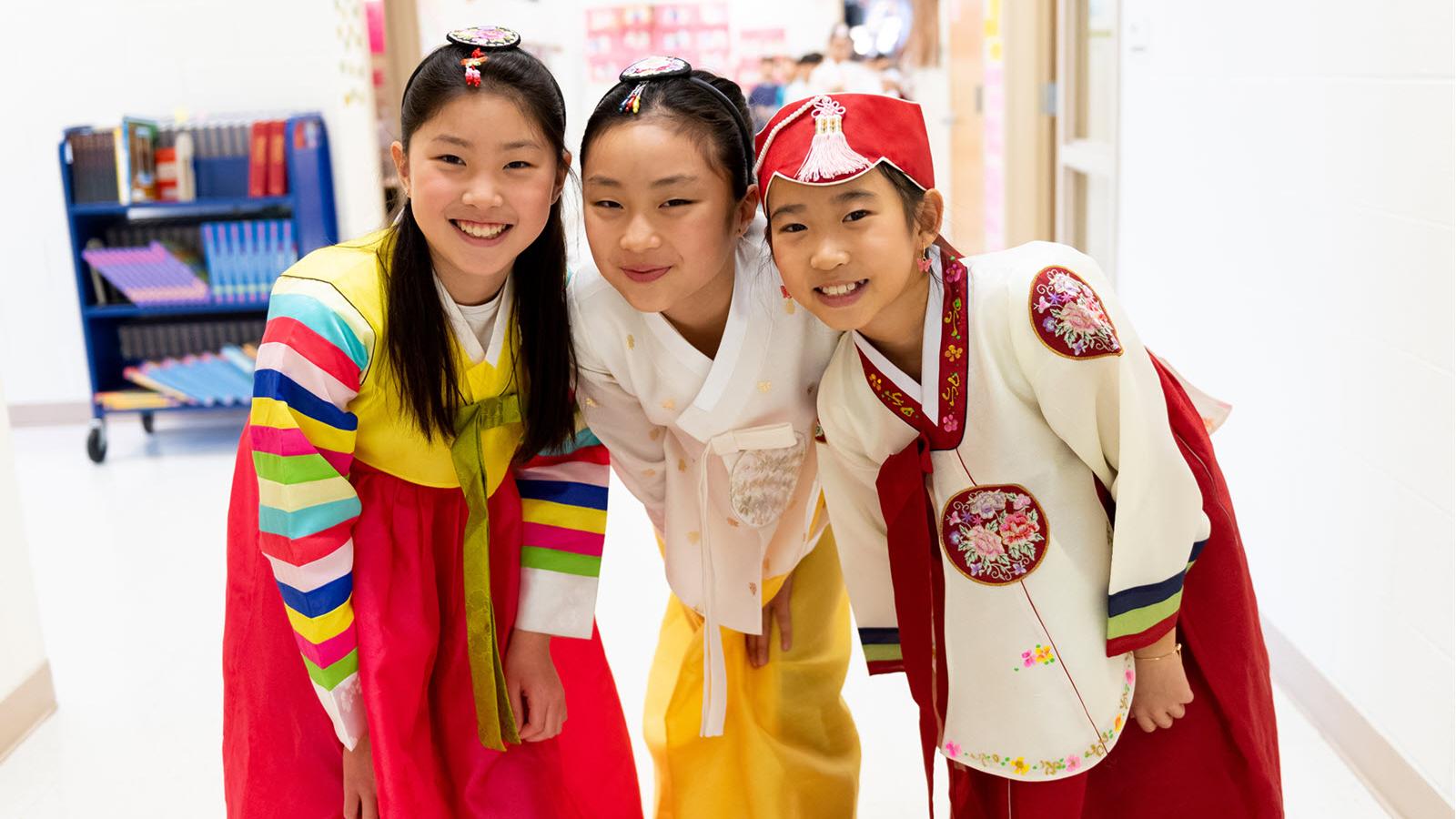 three students in Korean dress 