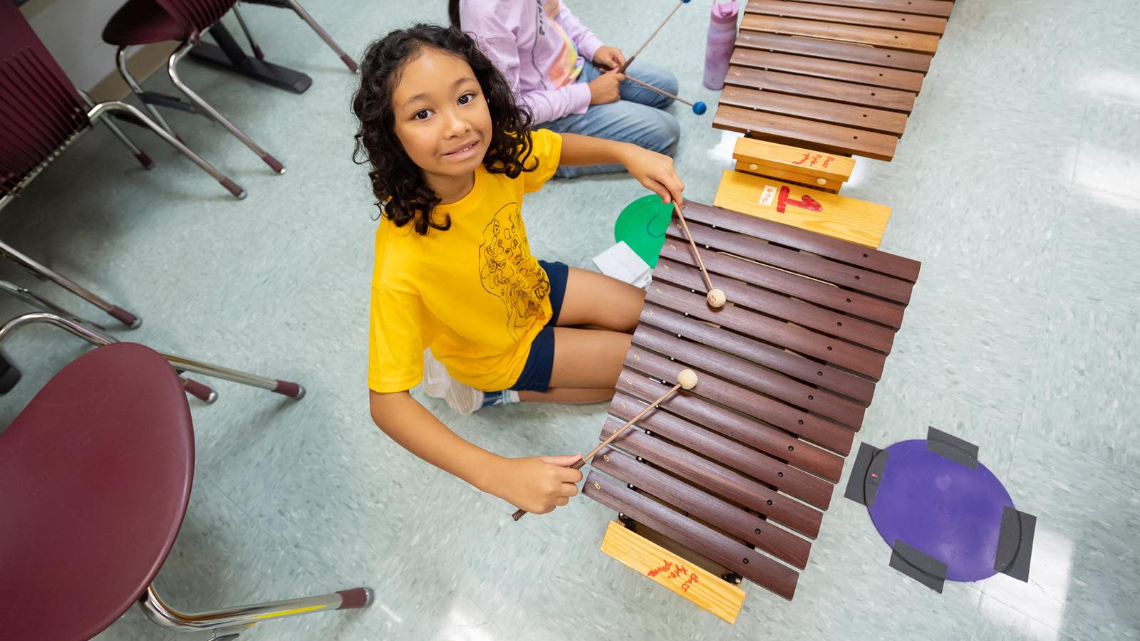student playing musical instrument