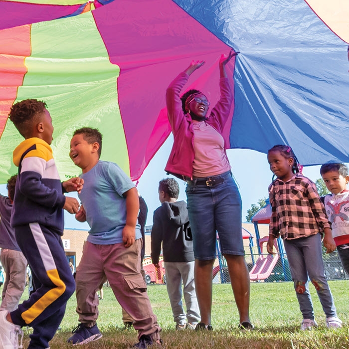 kids playing with parachute